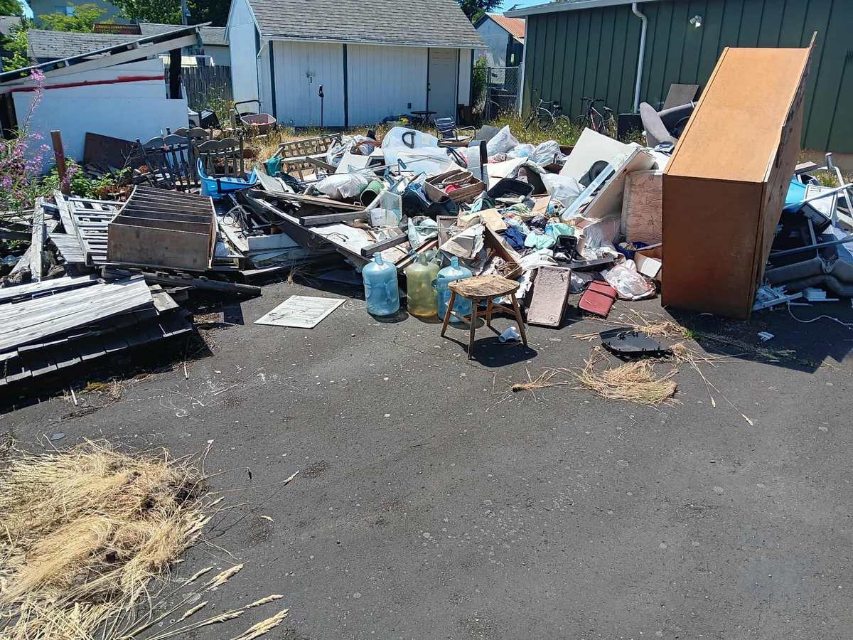 Household junk and debris piled before removal